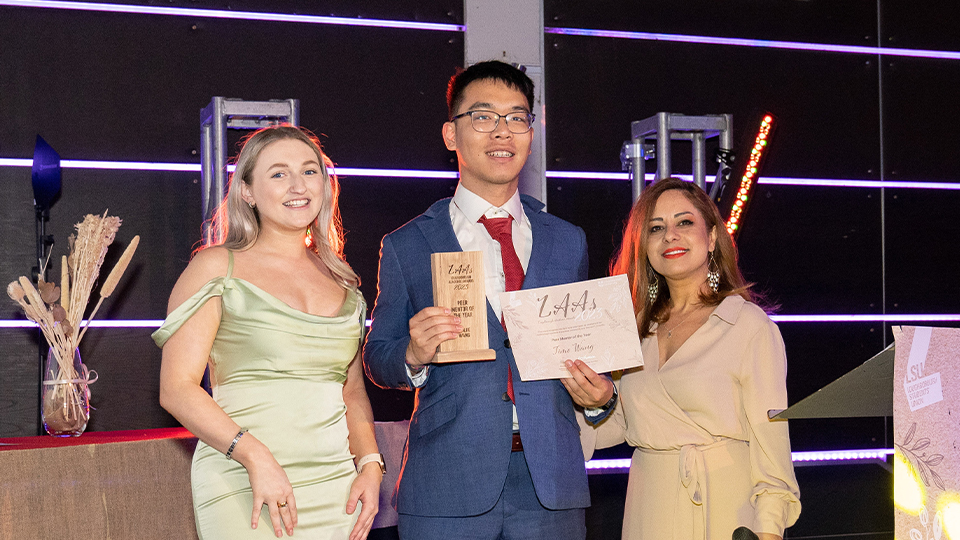 junjie, an ssehs student, collecting his award at the loughborough academic awards